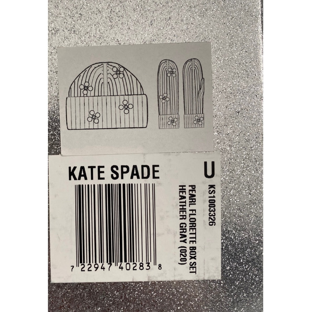 Kate Spade product tag with a hat and glove design on a grey background