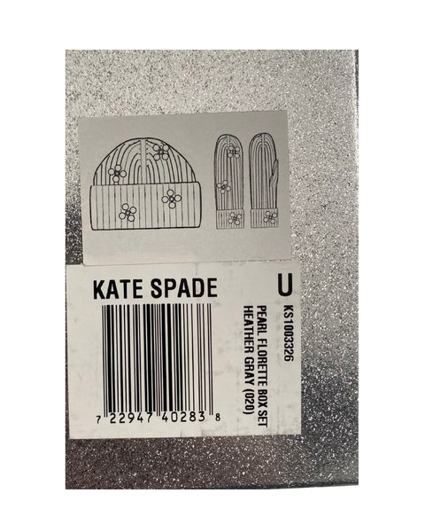 Kate Spade product tag with a hat and glove design on a grey background