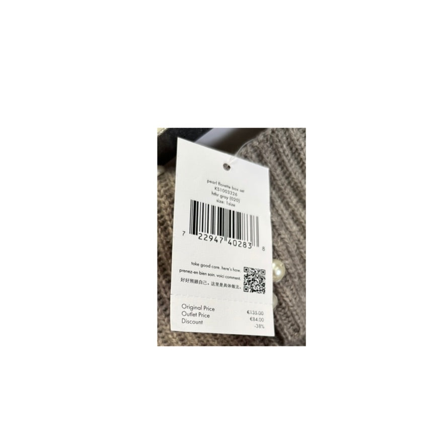Clothing tag with barcode and text on a textured fabric background