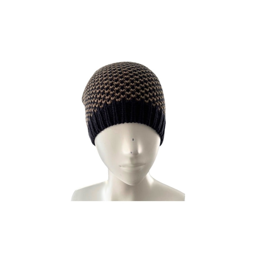 Knitted beanie on a mannequin head against a white background