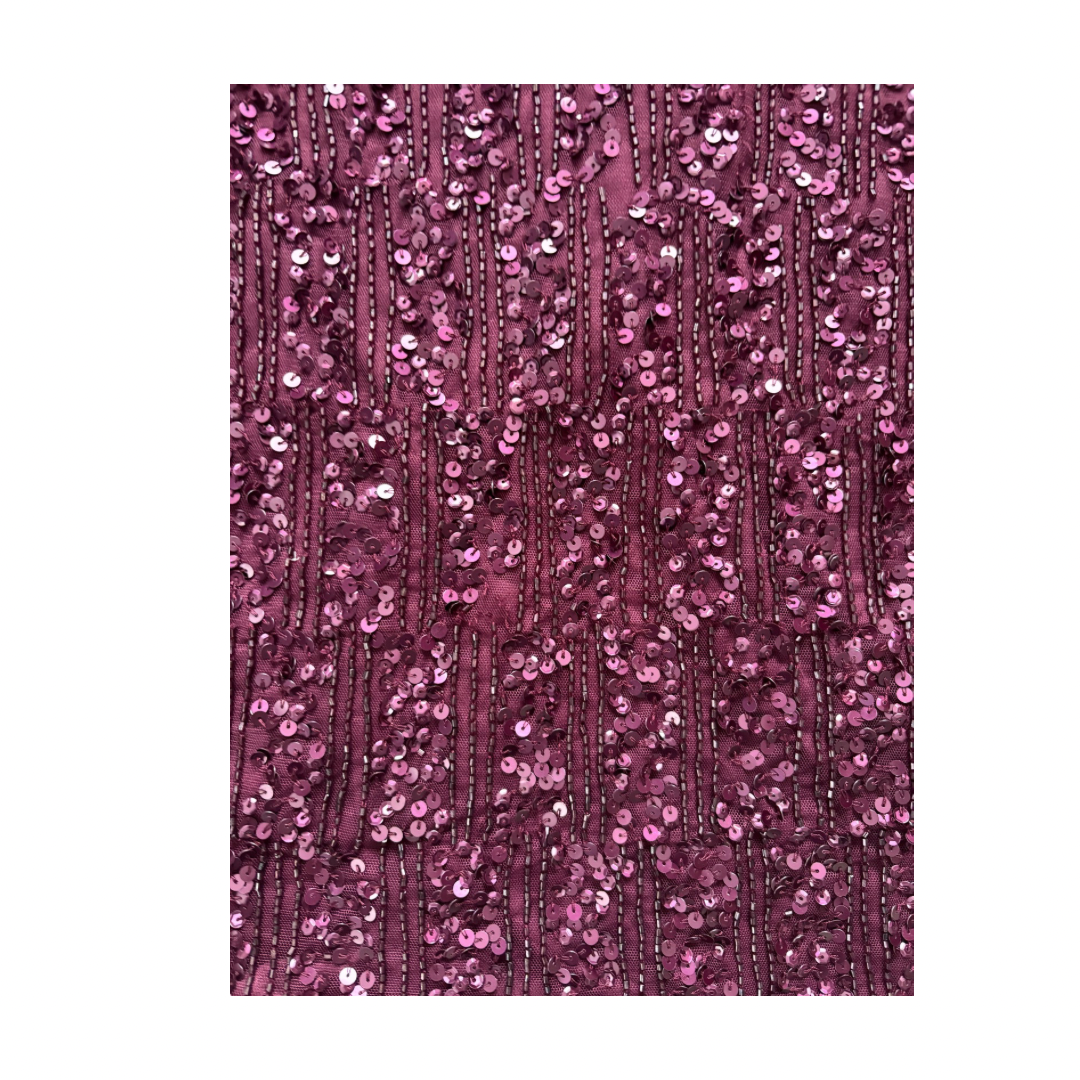Plum sequin fabric texture on a white background