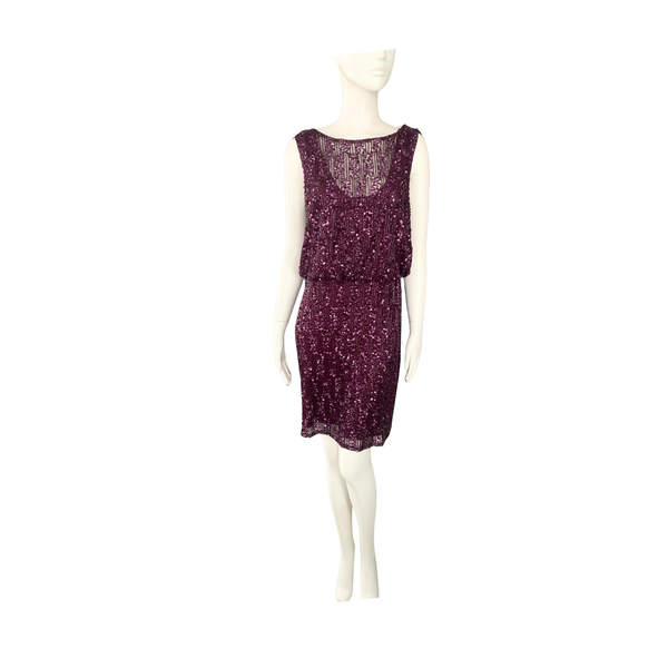 Mannequin wearing a purple dress on a white background