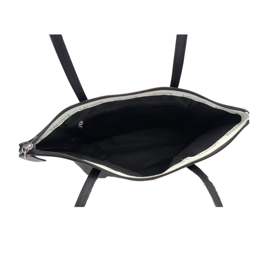 Black handbag with a zipper on a white background