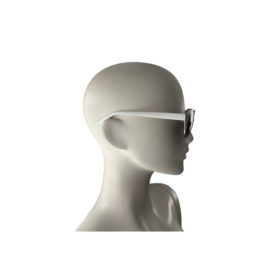Mannequin head wearing a white visor on a white background