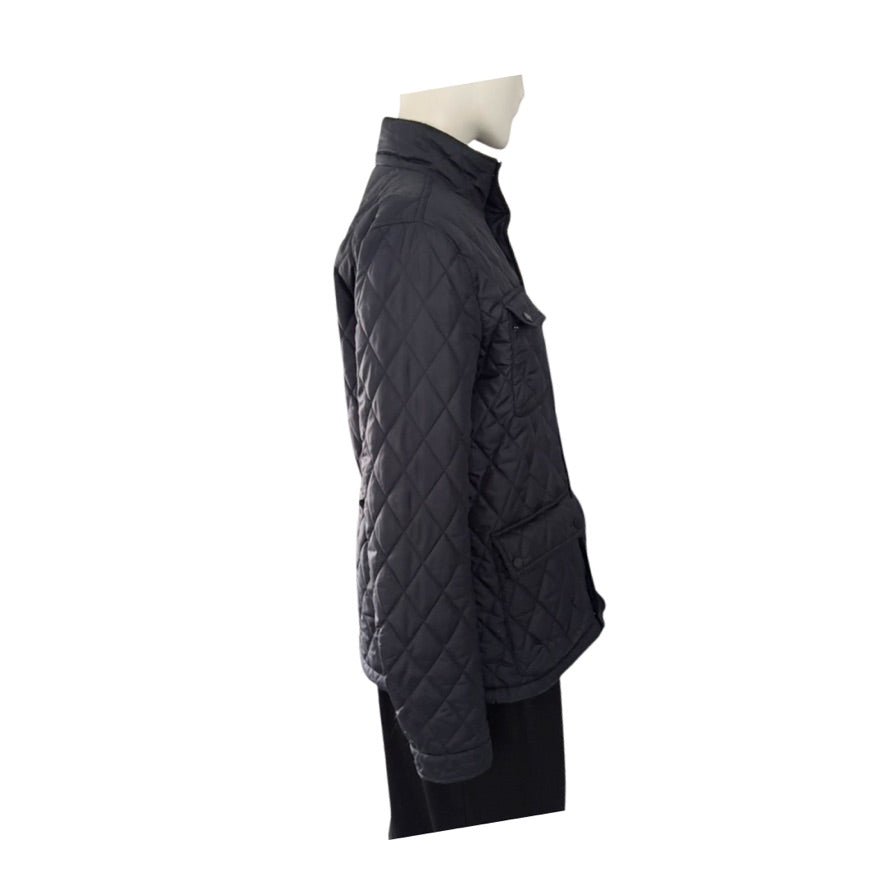 Navy quilted jacket on a mannequin against a white background