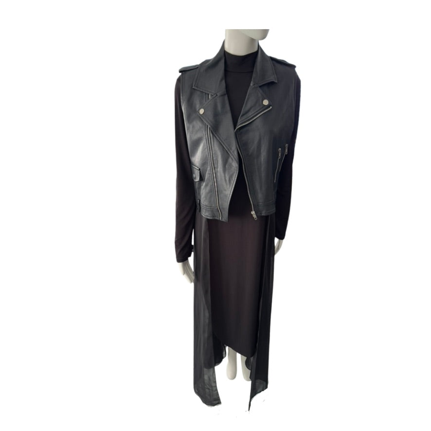 Mannequin wearing a black leather jacket and black dress on a white background