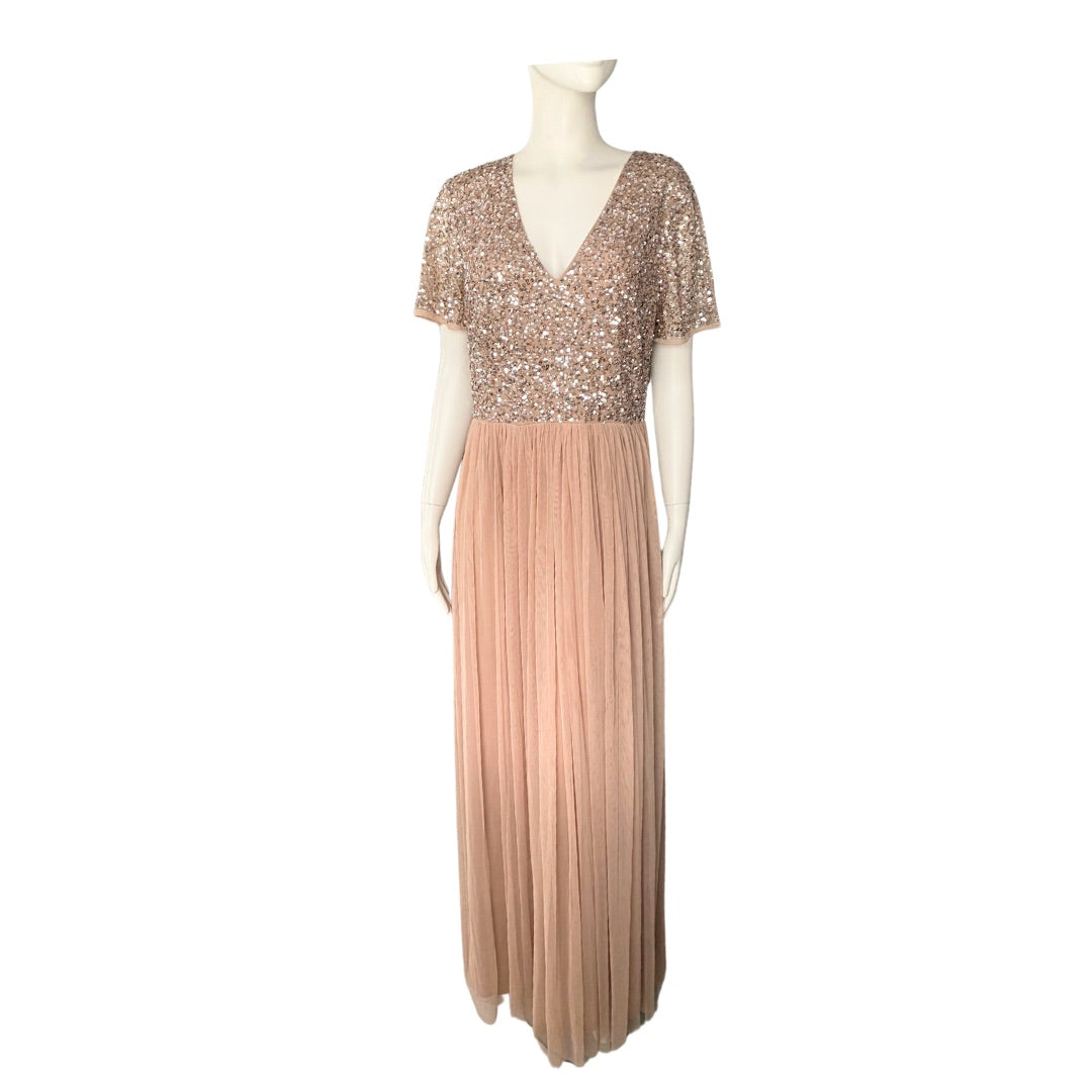 A sequin-embellished taupe maxi dress with a V-neckline, short sleeves, and a pleated tulle skirt, displayed on a mannequin.