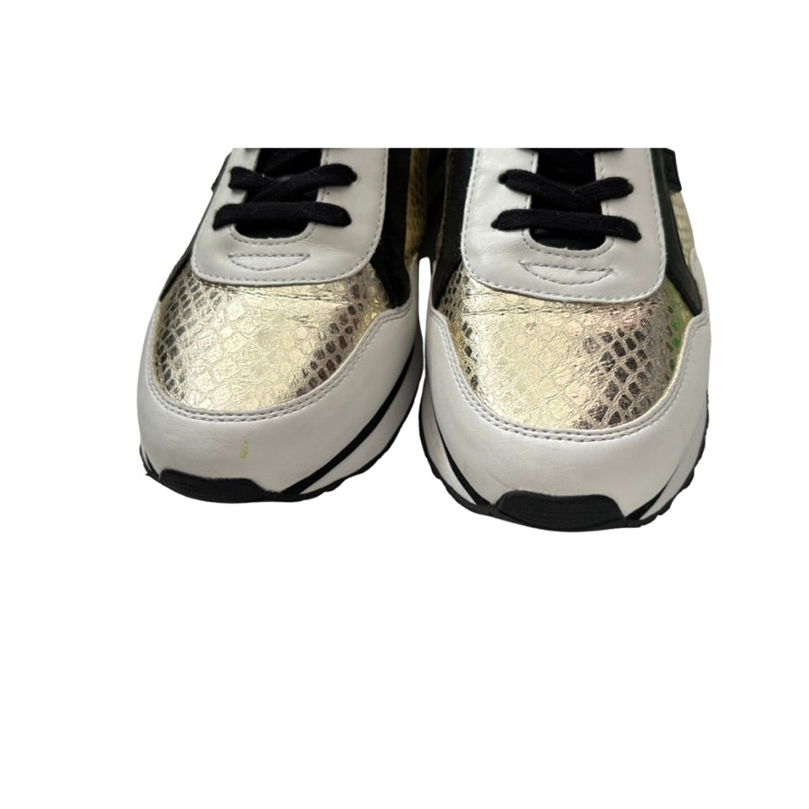 Pair of white sneakers with black soles and laces on a white background