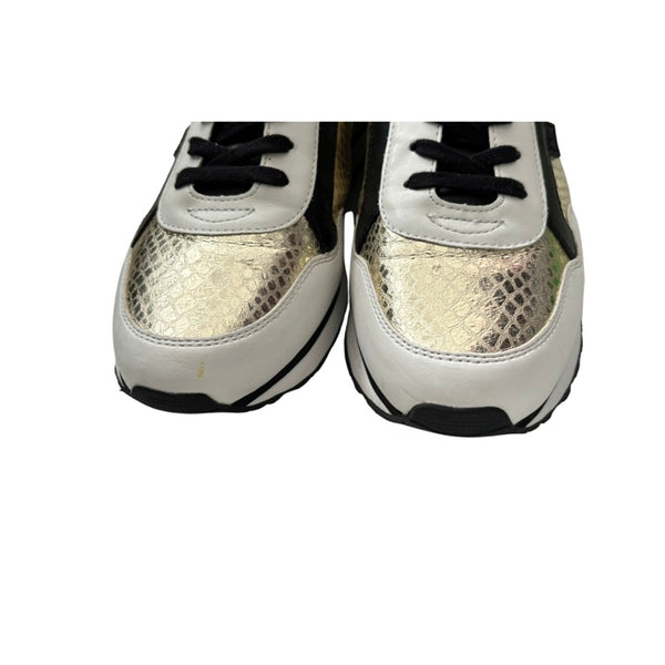 Pair of white sneakers with black soles and laces on a white background