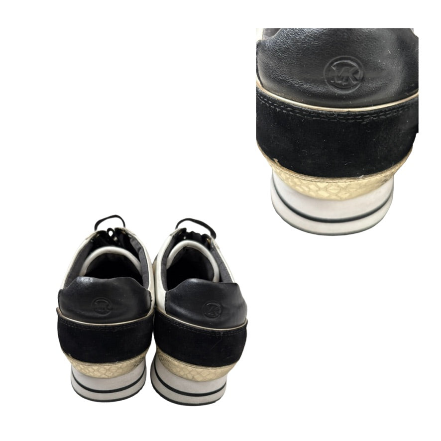 Black and gold shoes with a close-up of the sole on a white background