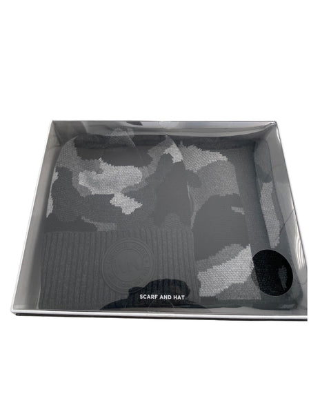 Grey camouflage scarf and hat set in a box on a white background
