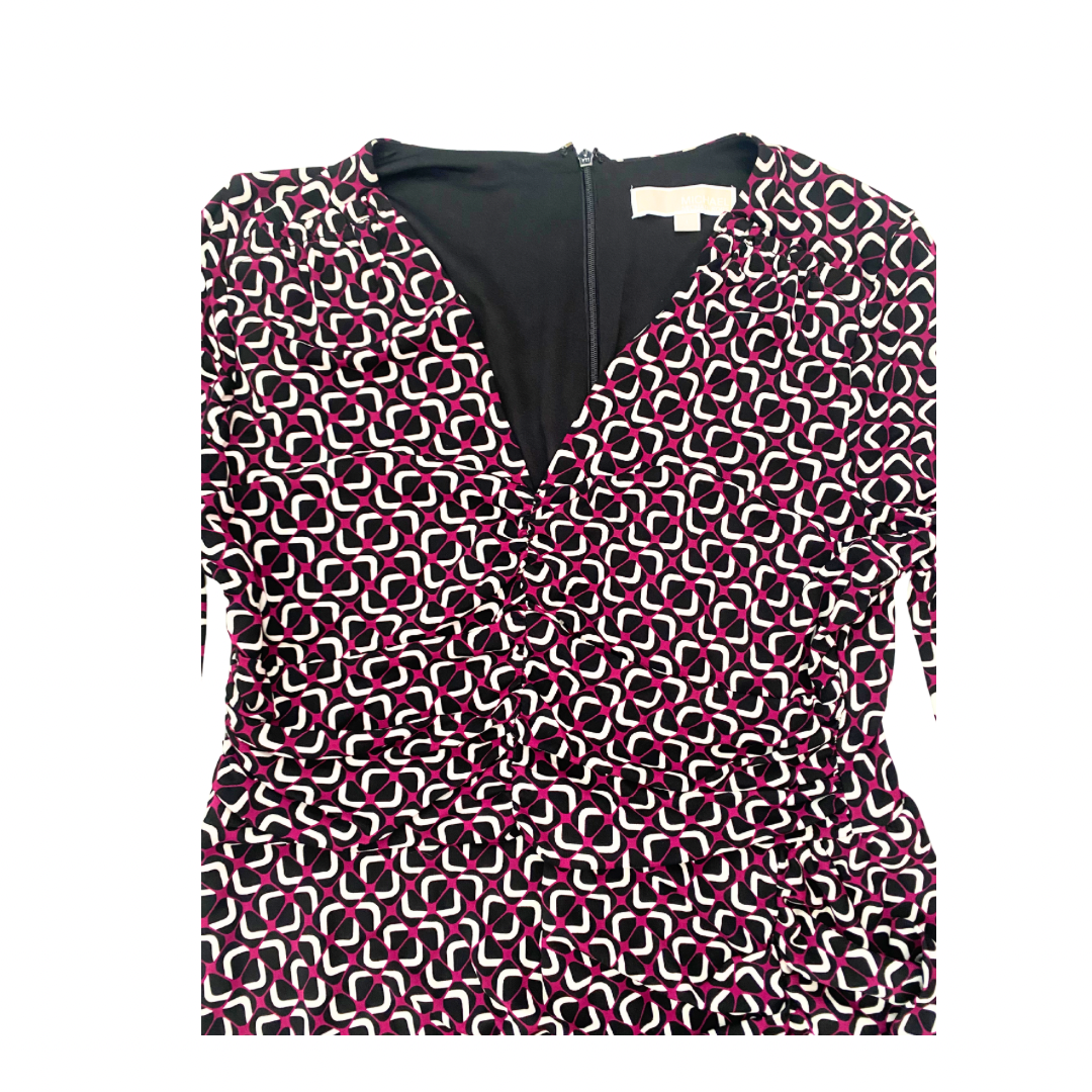 Close-up with geometric pattern dress on a white background