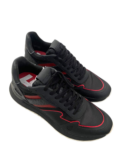 Black and red sneakers on a white background