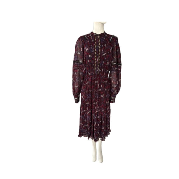 Long-sleeve dress with a pattern on a mannequin against a white background