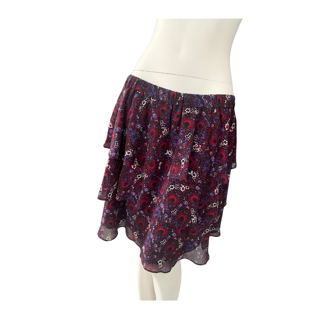 Paisley patterned skirt on a mannequin against a white background