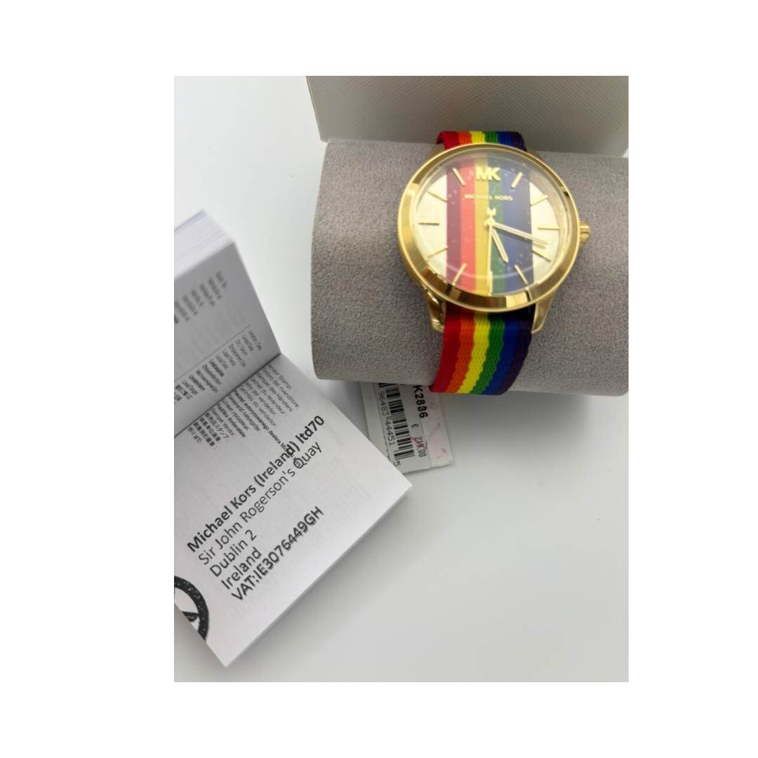 Watch with rainbow strap on a white surface with packaging
