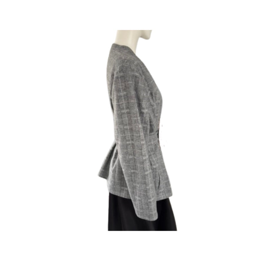 Mannequin wearing a gray textured jacket on a white background