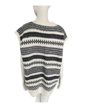 Black and white patterned sleeveless sweater on a mannequin against a white background