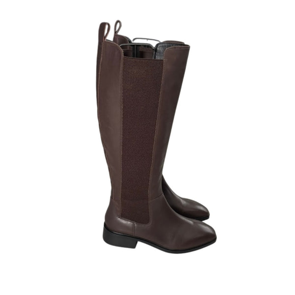 Pair of brown knee-high boots on a white background
