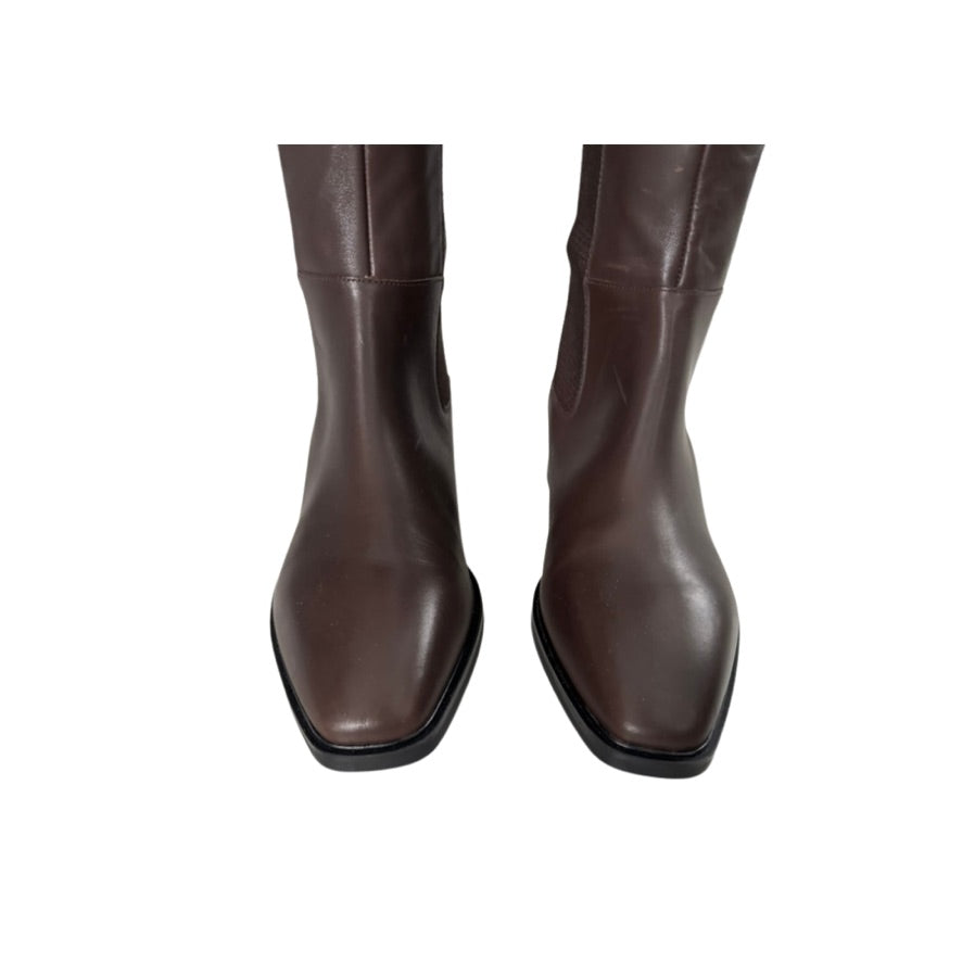 Pair of brown leather boots on a white background