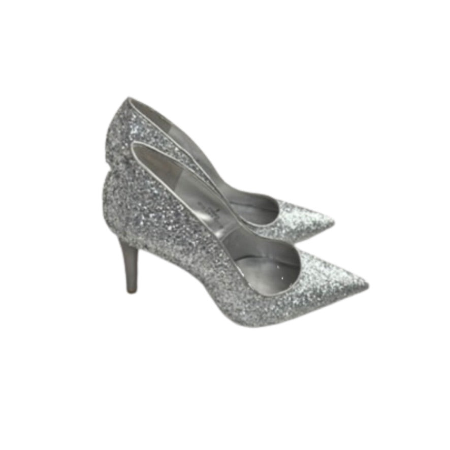 Silver glitter high-heeled shoes on a white background