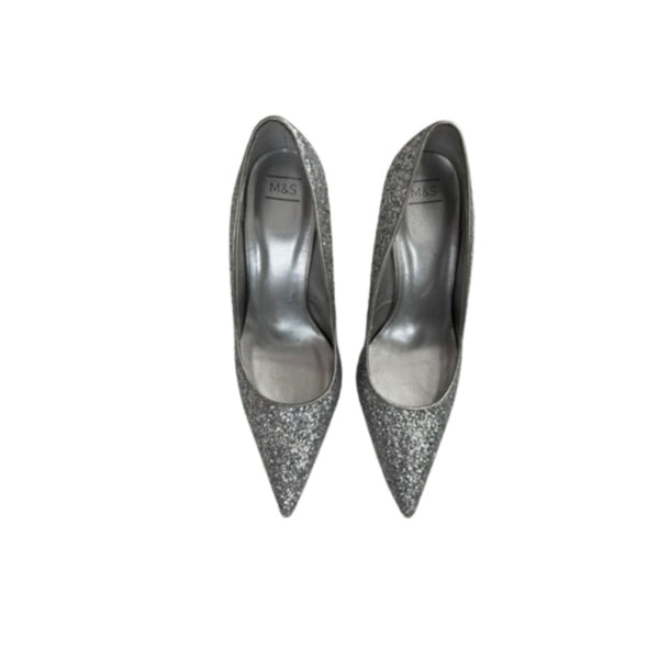 Pair of silver glitter high heels on a white background