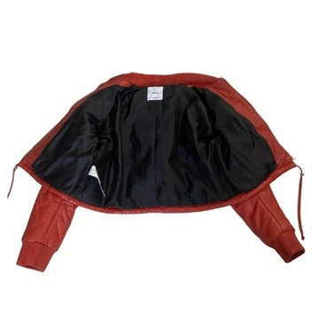 Orange jacket with black lining on a white background