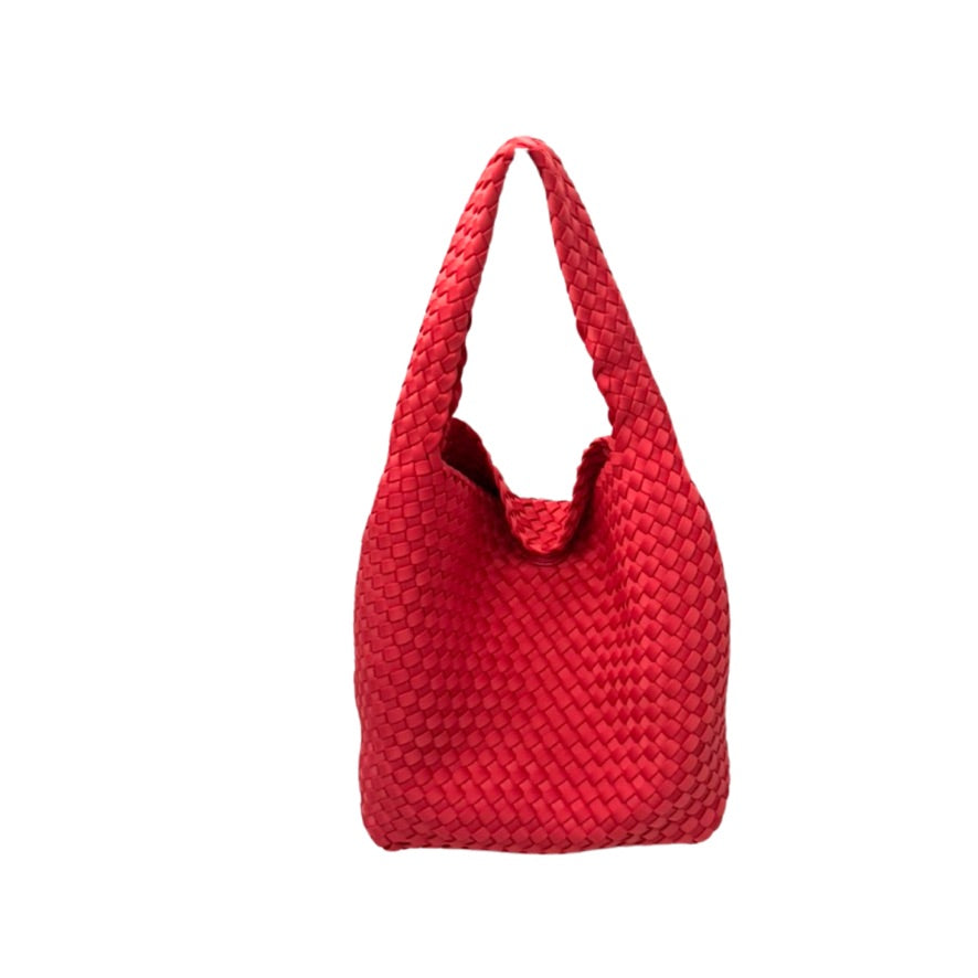 Red woven handbag on a white background