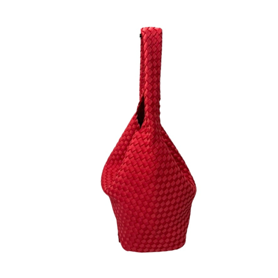 Red woven bag on a white background