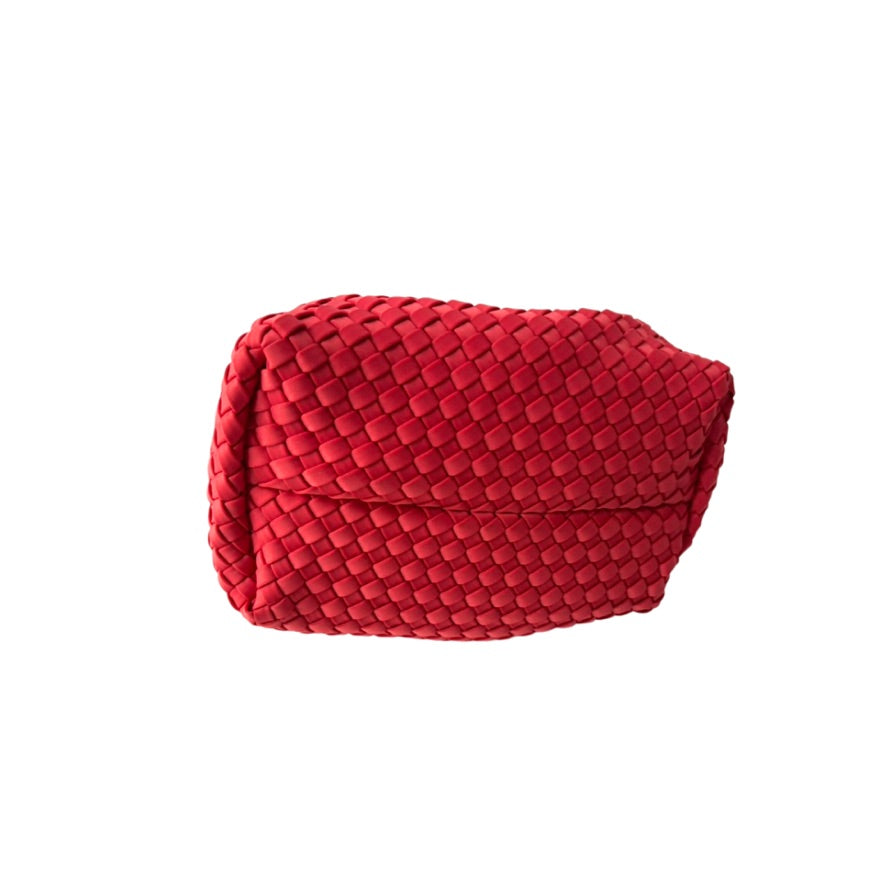 Red woven clutch bag on a white background