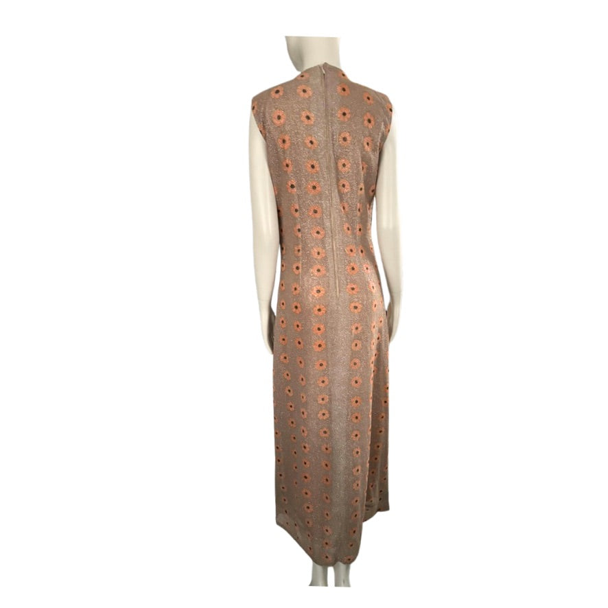 Mannequin wearing a sleeveless dress with a pattern on a white background