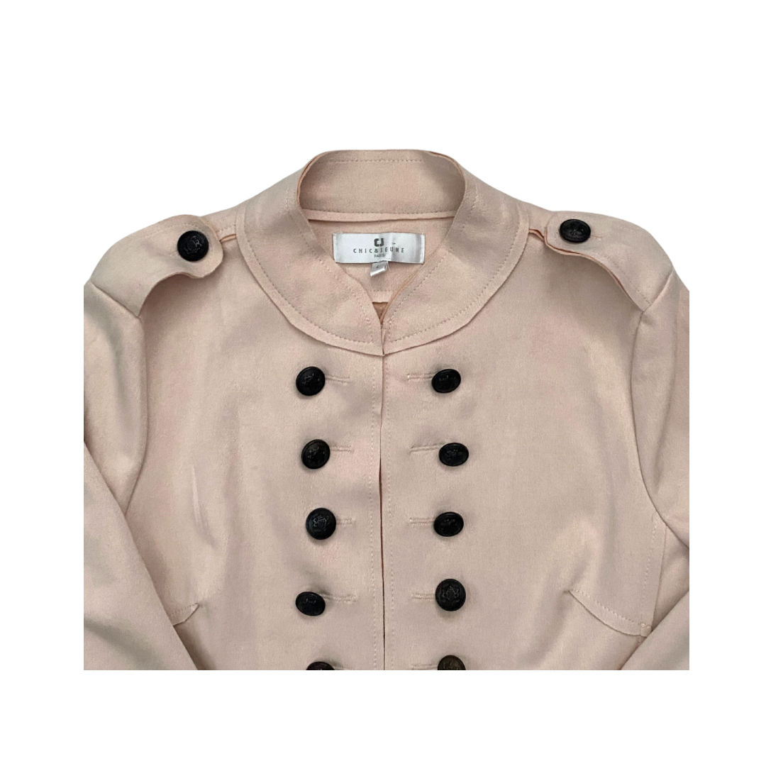 Pale pink jacket with black buttons on a white background