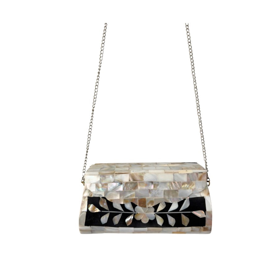 Clutch bag with floral pattern and chain strap on a white background