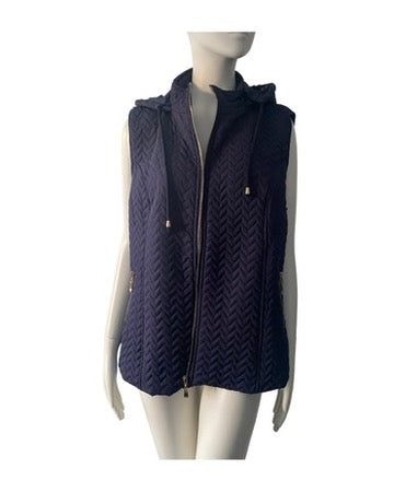 Navy blue quilted vest on a mannequin against a white background