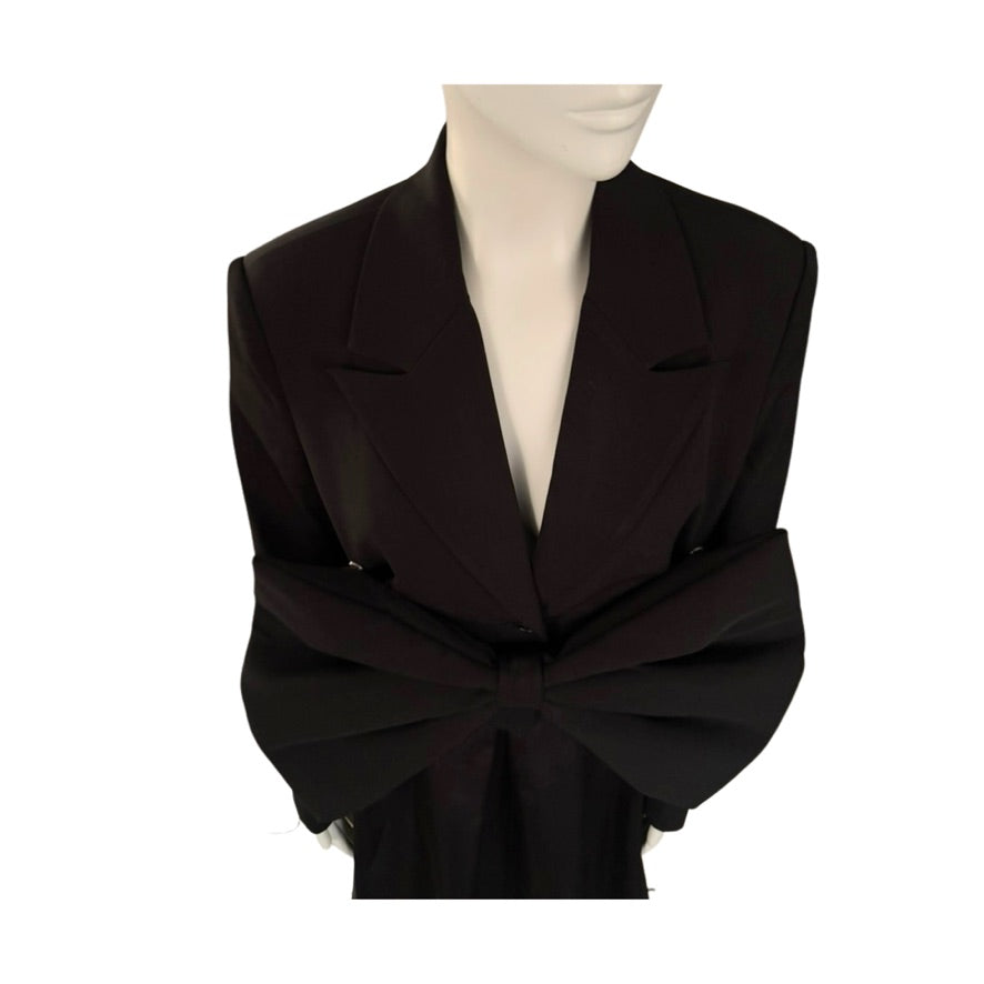 Black bow-tie jacket on a mannequin against a white background