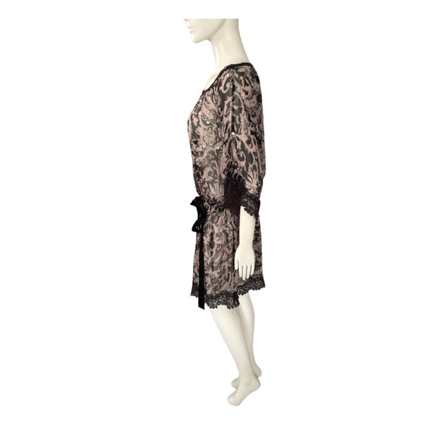Mannequin wearing a black lace dress on a white background
