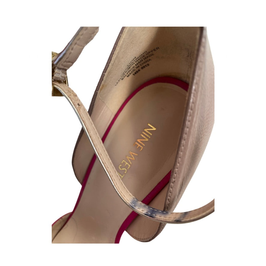 Close-up of a sandal with 'Nine West' branding on a white background