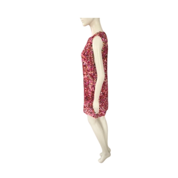 Mannequin wearing a red floral dress on a white background