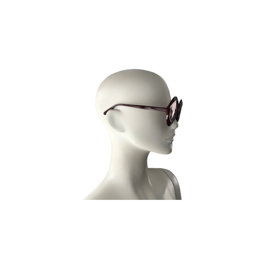 Sunglasses on a mannequin head against a white background