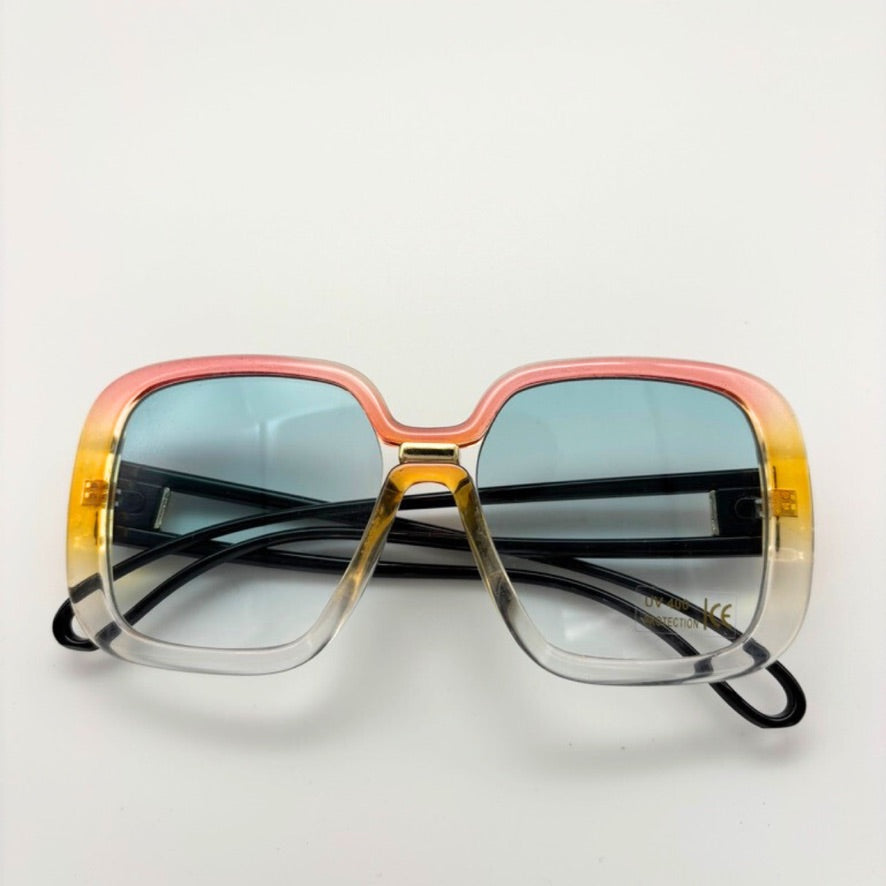 Sunglasses with a gradient frame on a light gray background