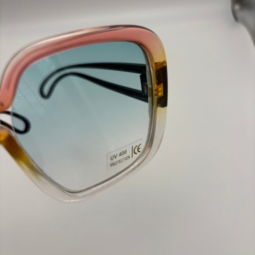 Sunglasses with a reflective surface on a light background