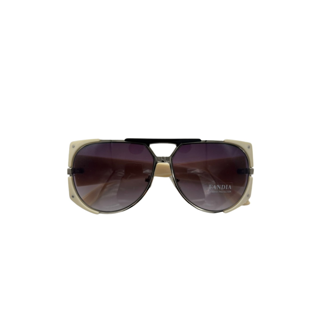 Sunglasses with a gold frame and dark lenses on a white background