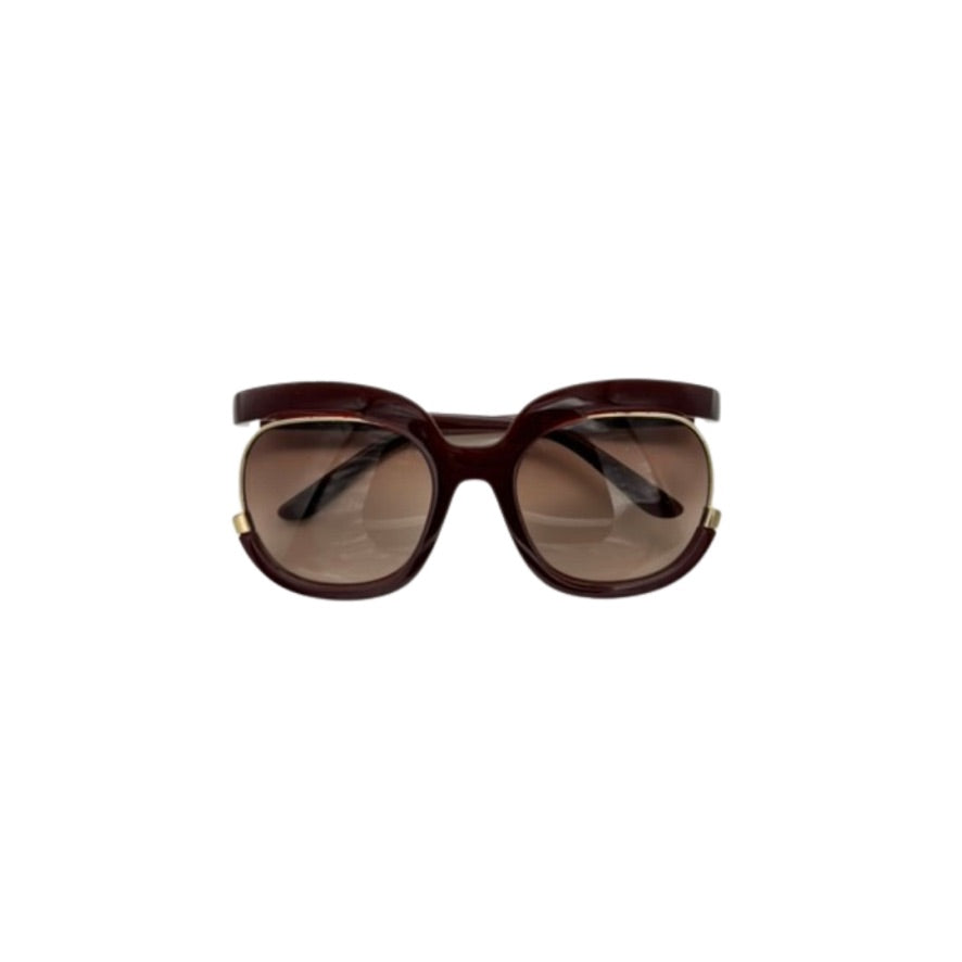 Burgundy sunglasses on a white background
