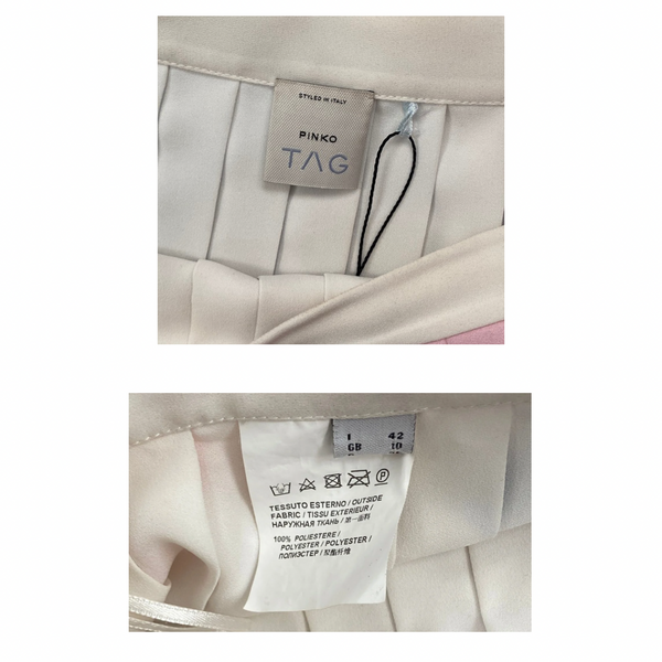 Close-up of a Pinko label on a garment with additional text and symbols.