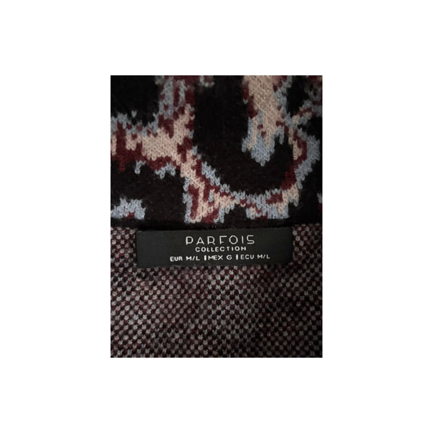 Textile with a patterned design and 'Parfois' brand label on a white background