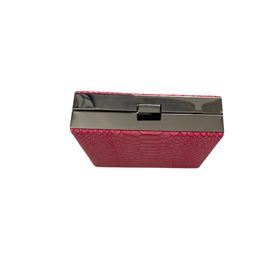 Pink clutch bag with a metallic finish on a white background