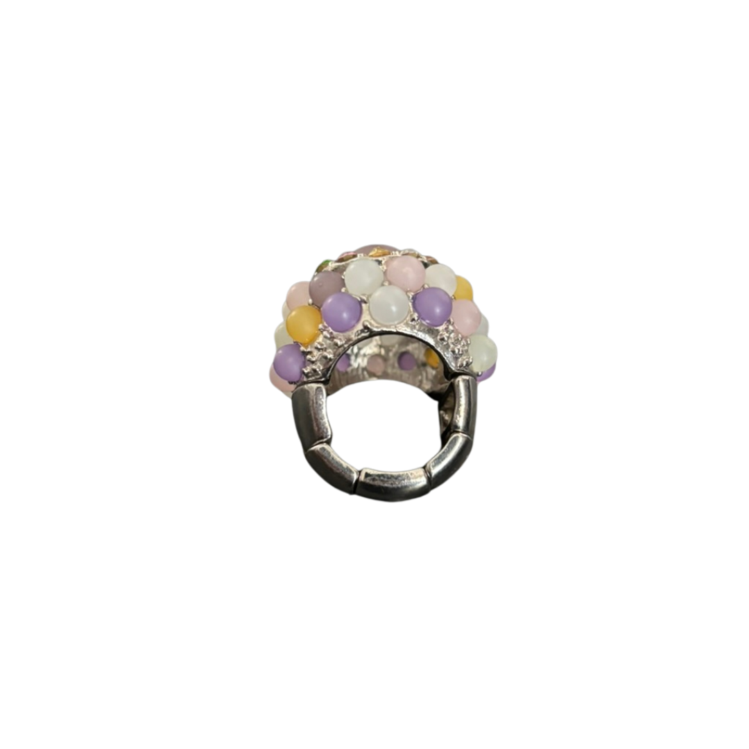 Decorative ring charm with multicolored beads on a white background