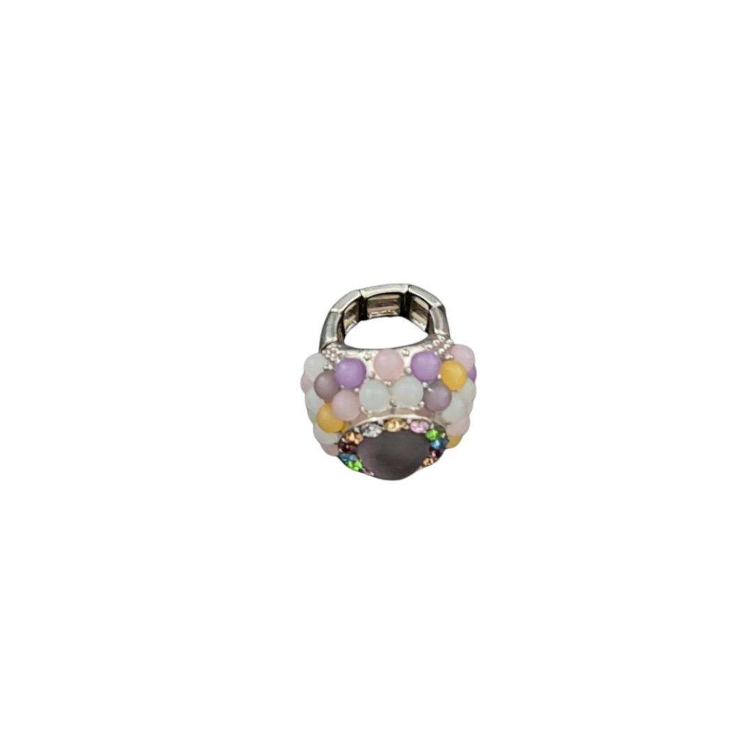 Small ring with multicolored gemstones on a white background