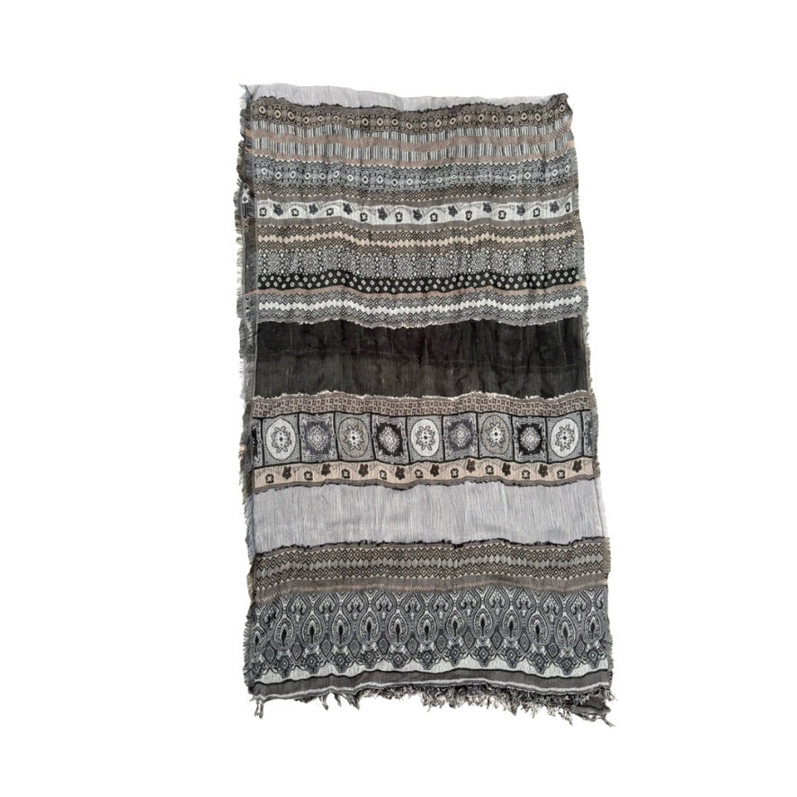 Patterned scarf with fringe on a white background