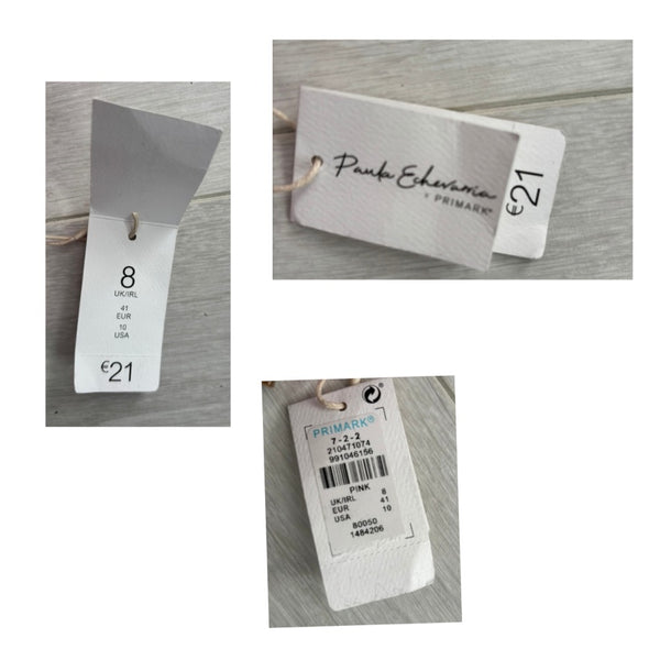 Collage of clothing tags with brand names on a wooden surface